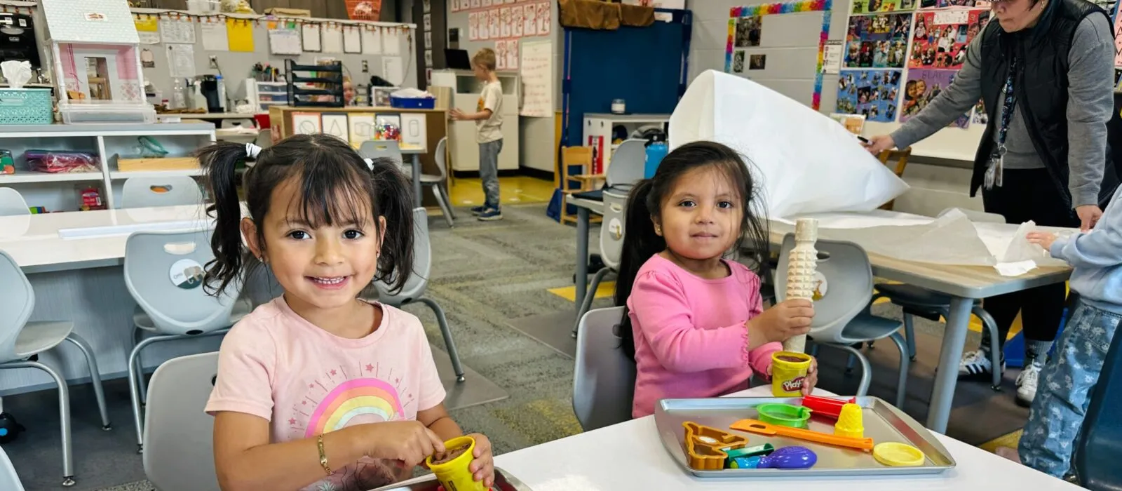 Preschool students creating with play doh homepage