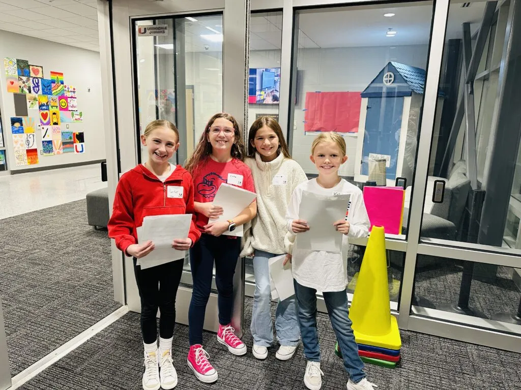 Olmsted students greeting visitors at the Jensen Jubilee