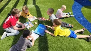 Valerius students outside reading together