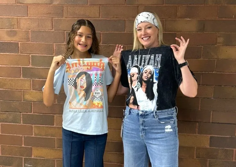 UMS teacher and student with same favorite band shirt crop2